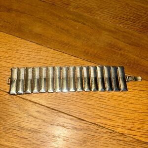VINTAGE 1950s-1960s era silver tone bracelet. 1.5 in wide.